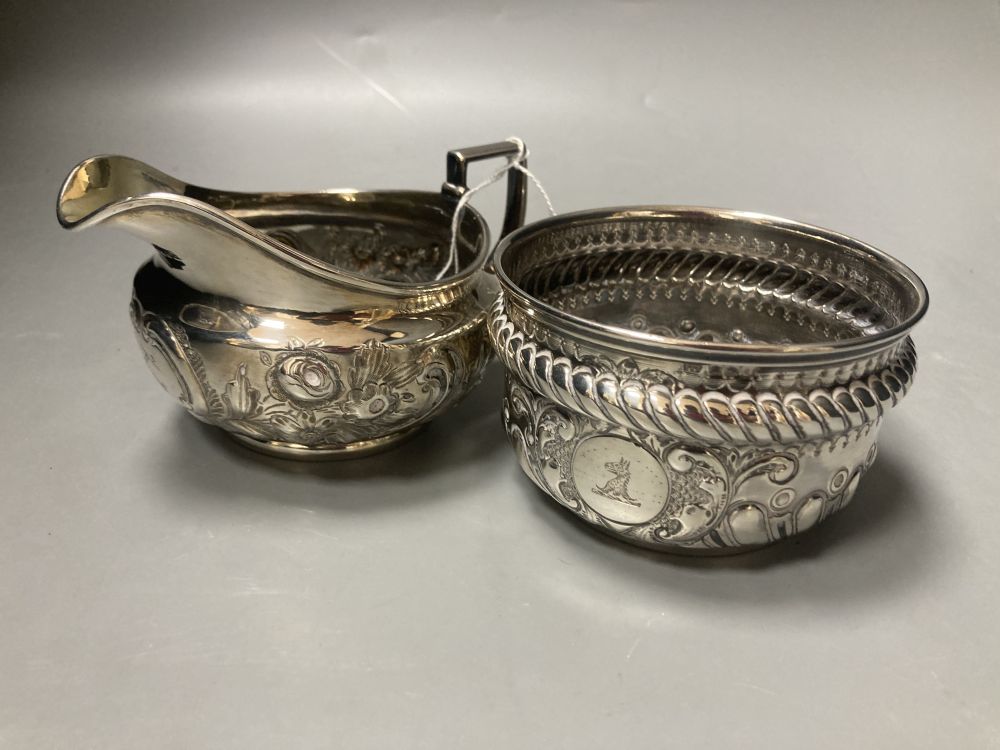 A George III embossed silver cream jug, Emes & Barnard, London, 1812 and a later silver sugar bowl, 11.5oz.